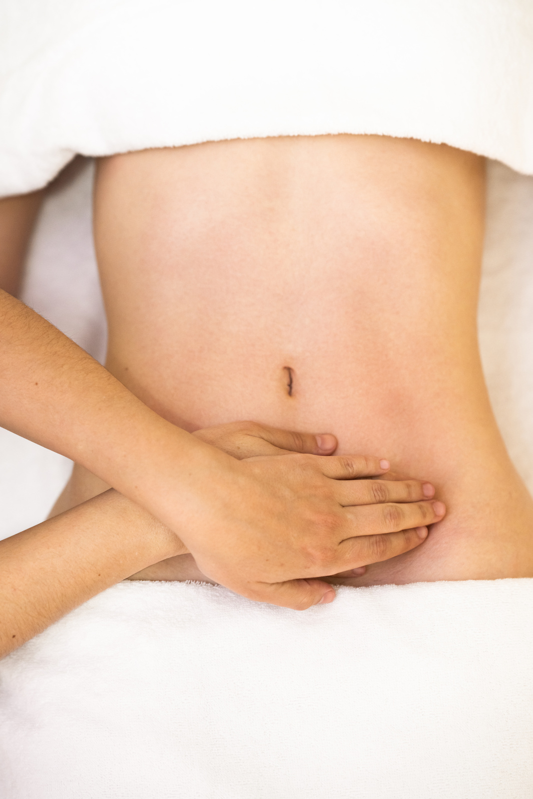 Woman Receiving Belly Massage at Spa Salon